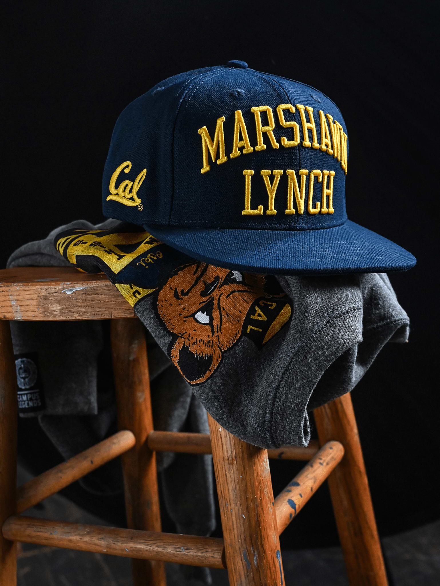 CAL - Marshawn Lynch 10 Navy Snapback Hat - Roots of Fight