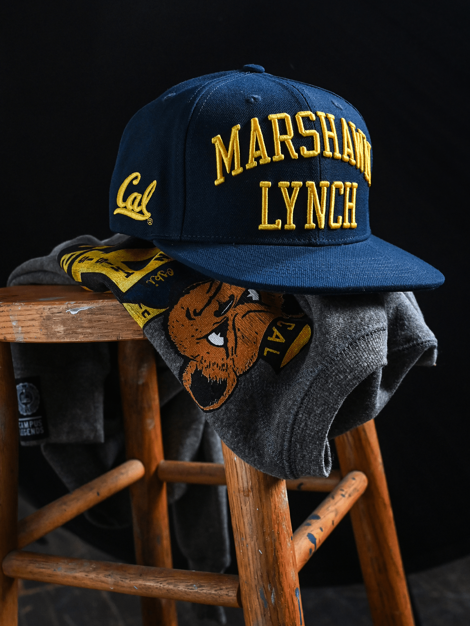 CAL - Marshawn Lynch 10 Navy Snapback Hat - Roots of Fight