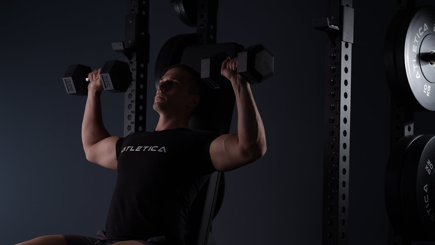 Dumbbell exercises on the weight bench