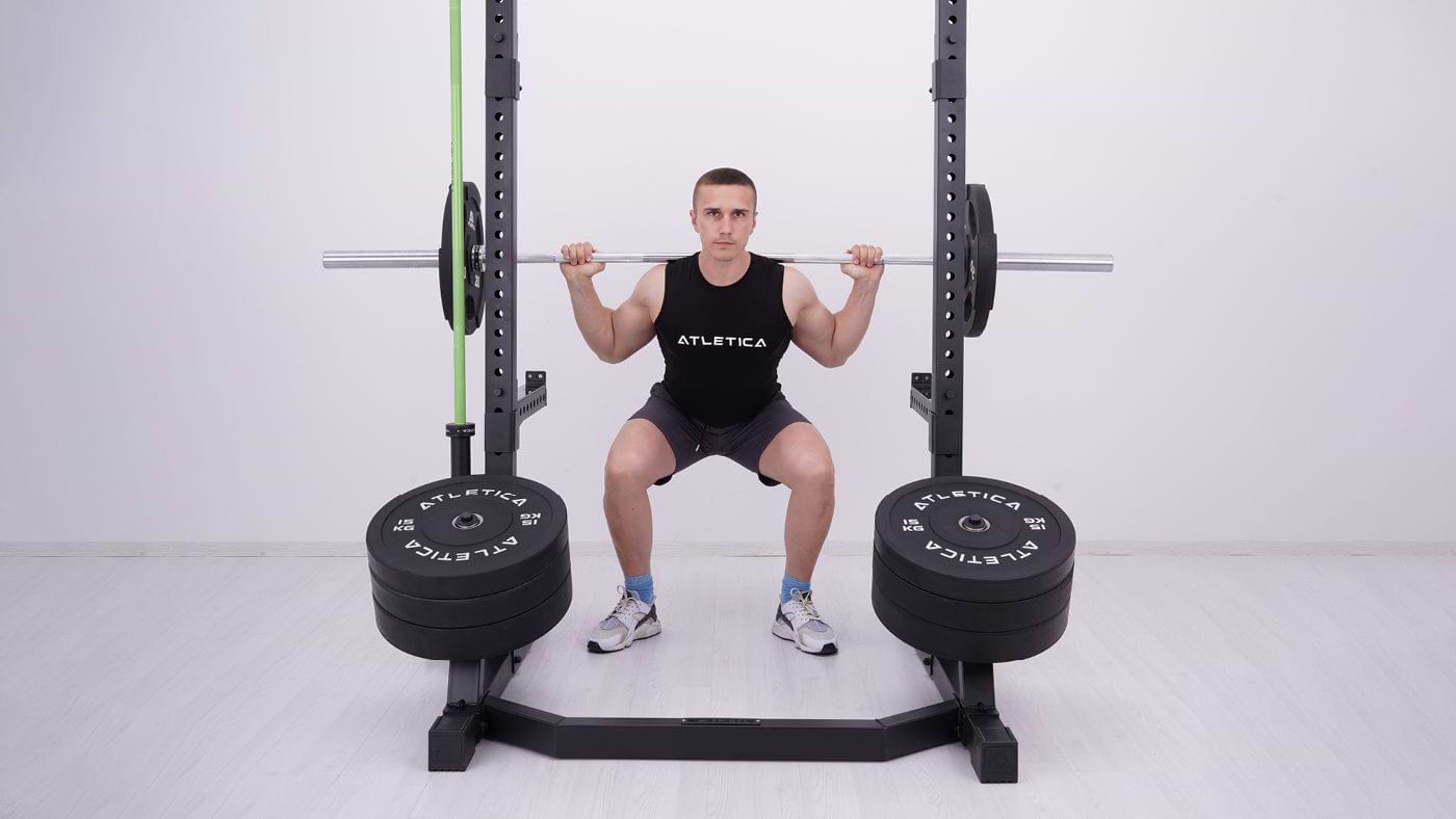 Power rack squats in the sports club