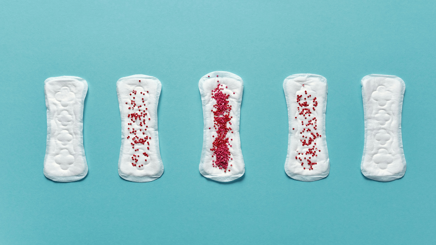 Five sanitary pads on a blue background, illustrating varying menstrual flow levels with red beads.