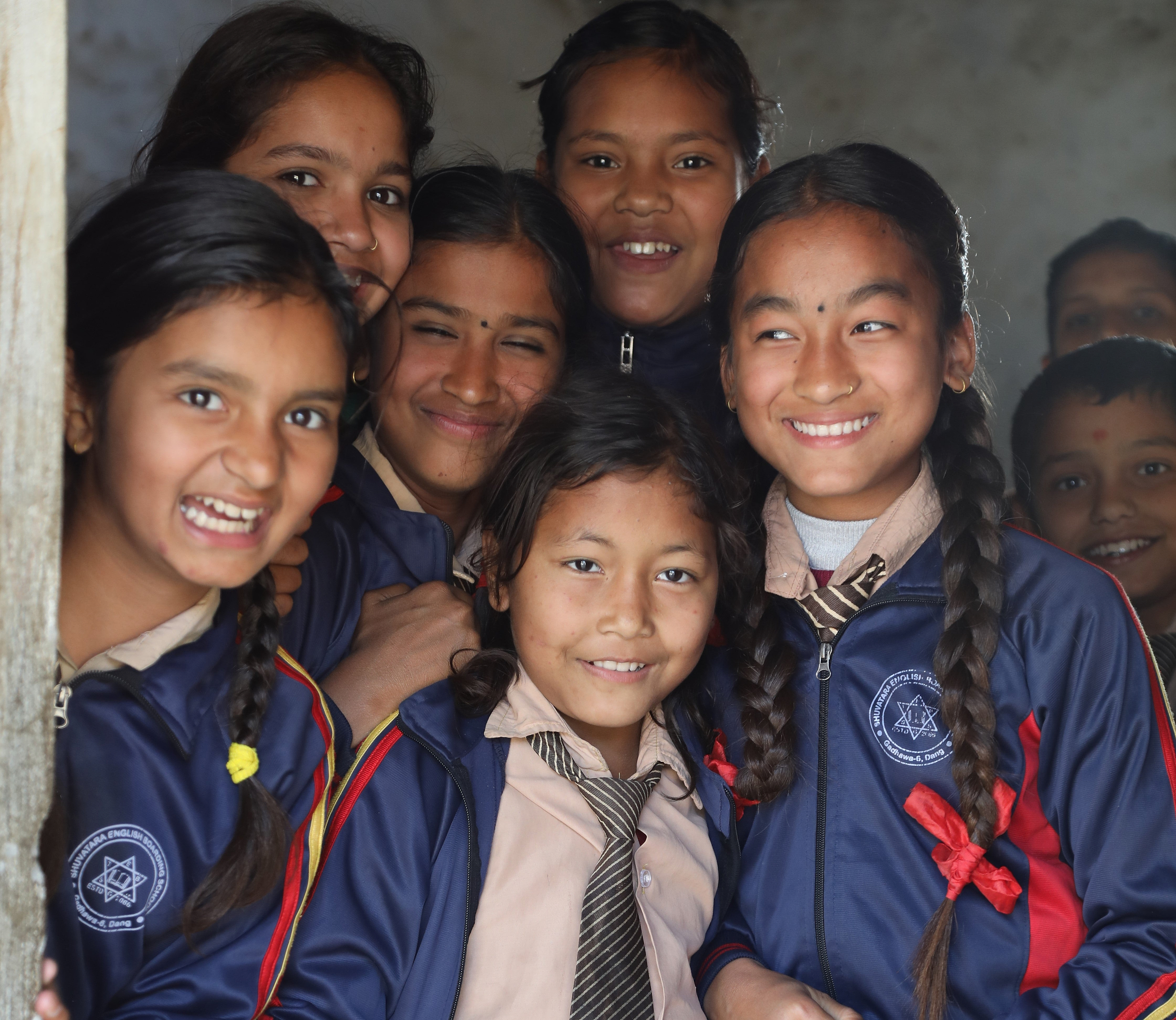 Group of Girls and Impact Her Banner