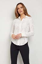 The Best Travel Top. Woman Showing the Front Profile of a Lace Taylee Top in White.