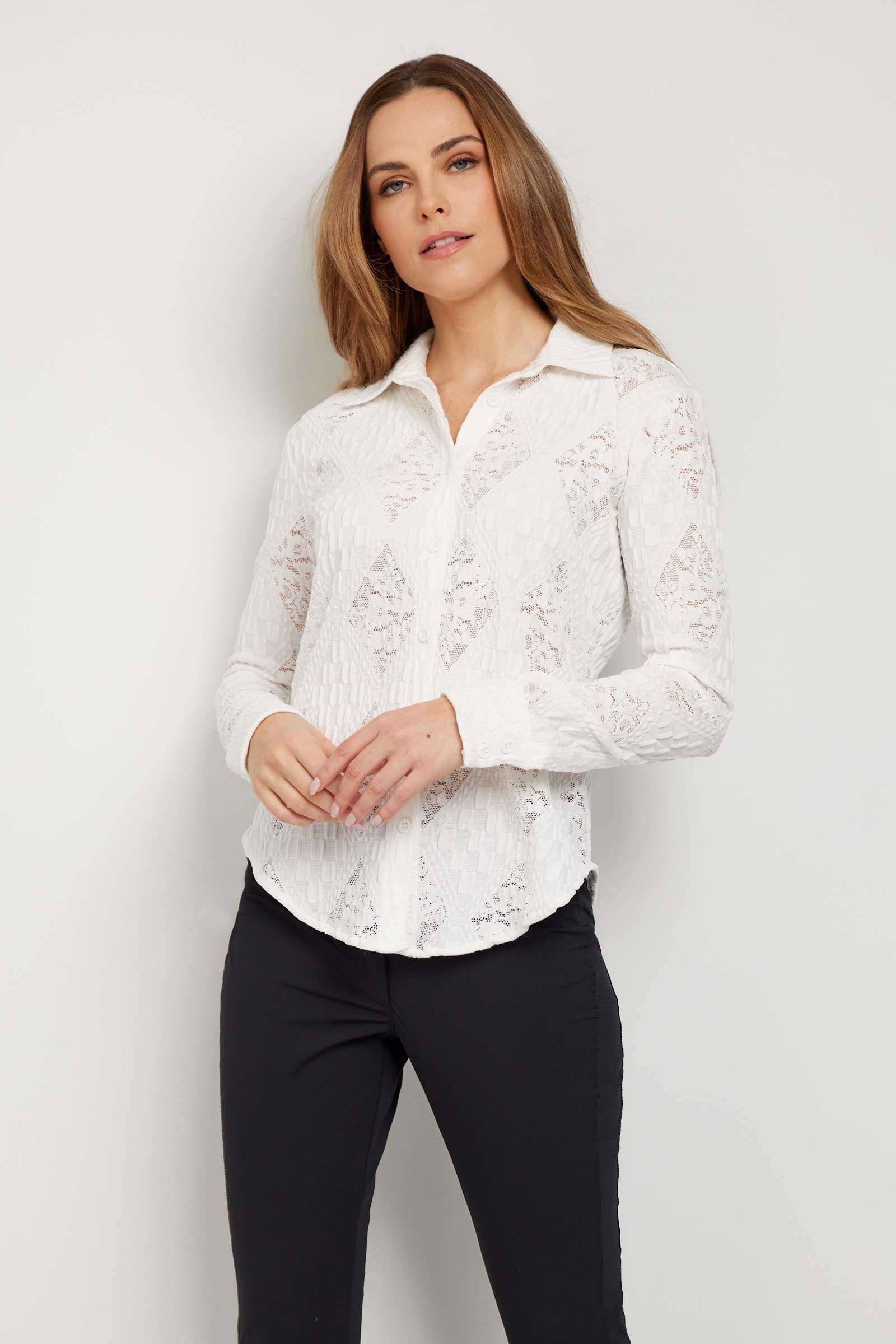 The Best Travel Top. Woman Showing the Front Profile of a Lace Taylee Top in White.