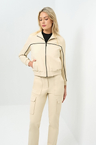 Font view of cream bomber jacket with black pinstripe detailing zipped up to collar