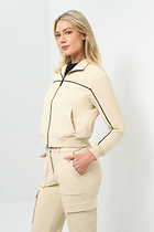 Side view of cream bomber jacket with black pinstripe detailing zipped up to collar
