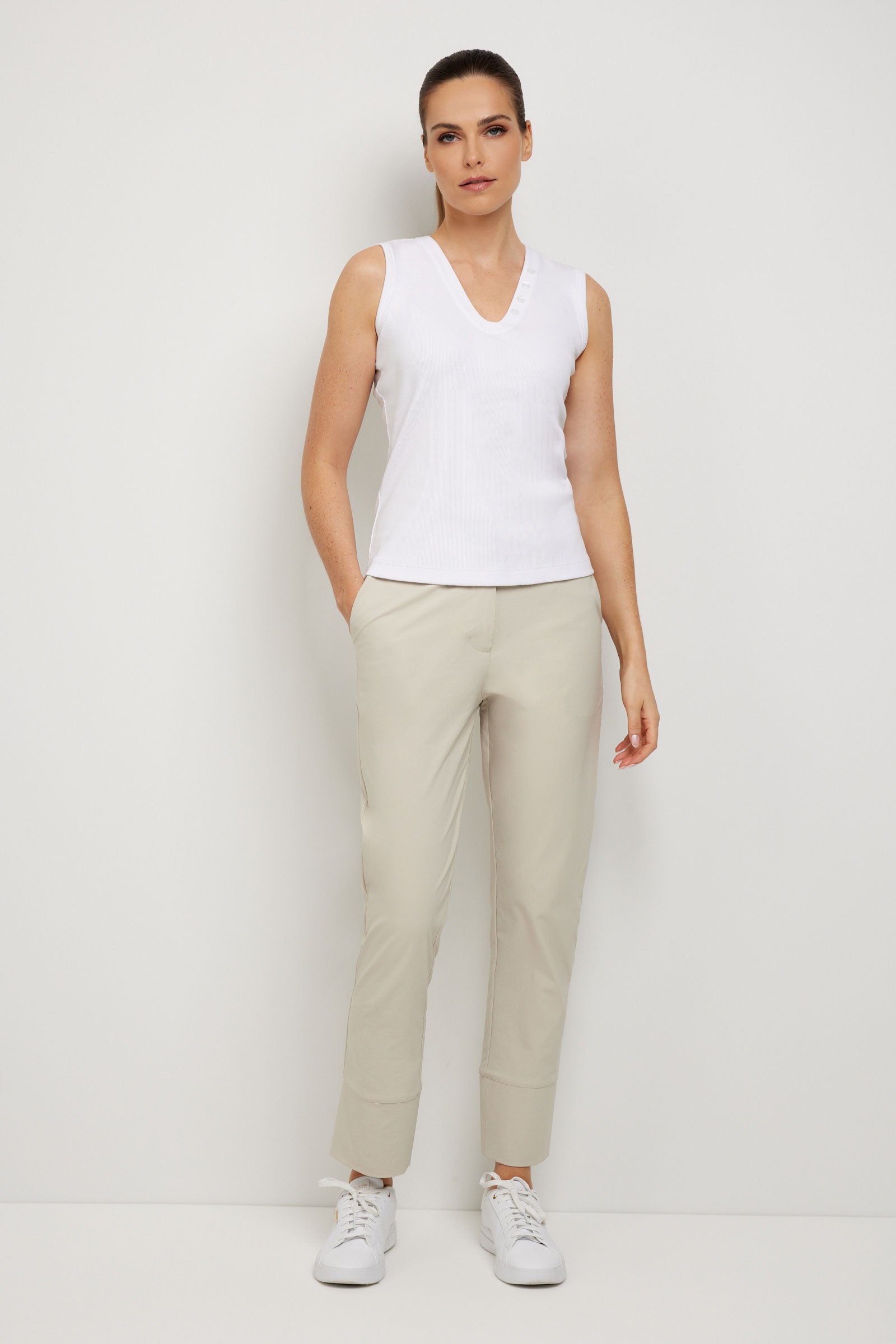 The Best Travel Top. Woman Showing the Front Profile of a Madelyn Top in White.