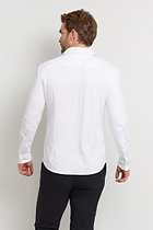 The Best Travel Top. Man Showing the Back Profile of a Men's Nick Top in White.