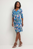 The Best Travel Dress. Woman Showing the Side Profile of a Marine Printed Dress in Persian Floral.