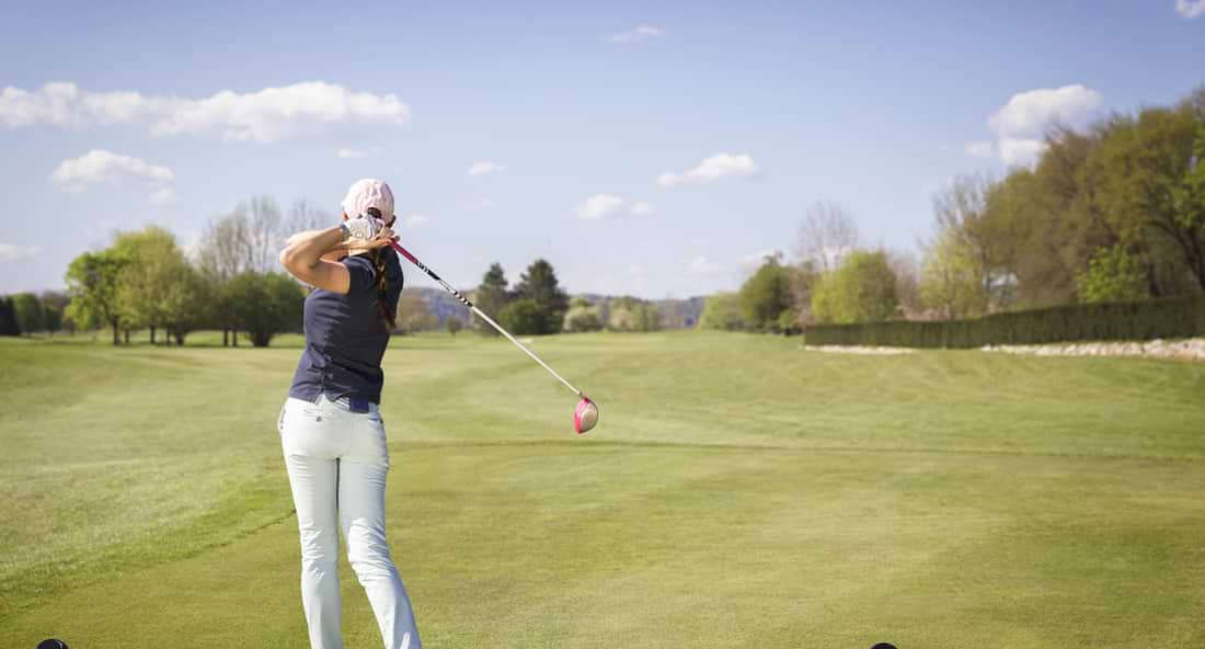 Women Golfing Wearing Proper Golf Attire for Women