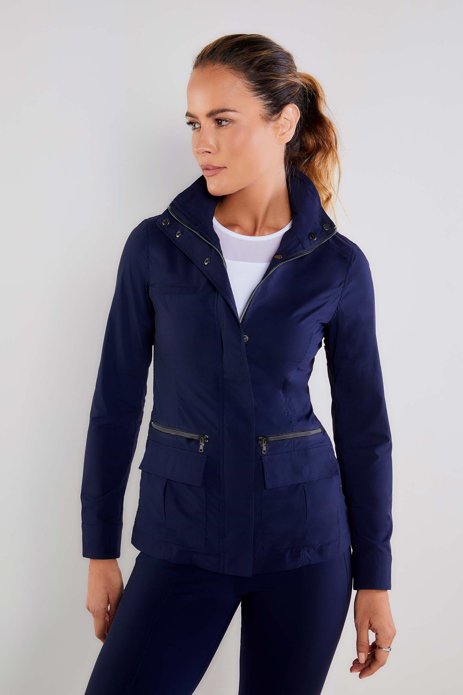 The Best Travel Safari Jacket. Woman Showing the Side Profile of a Safari Jacket in Navy