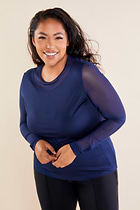 The Best Travel Top. Woman Showing the Front Profile of a Kim Mesh-Sleeve Top in Pima Modal in Navy.