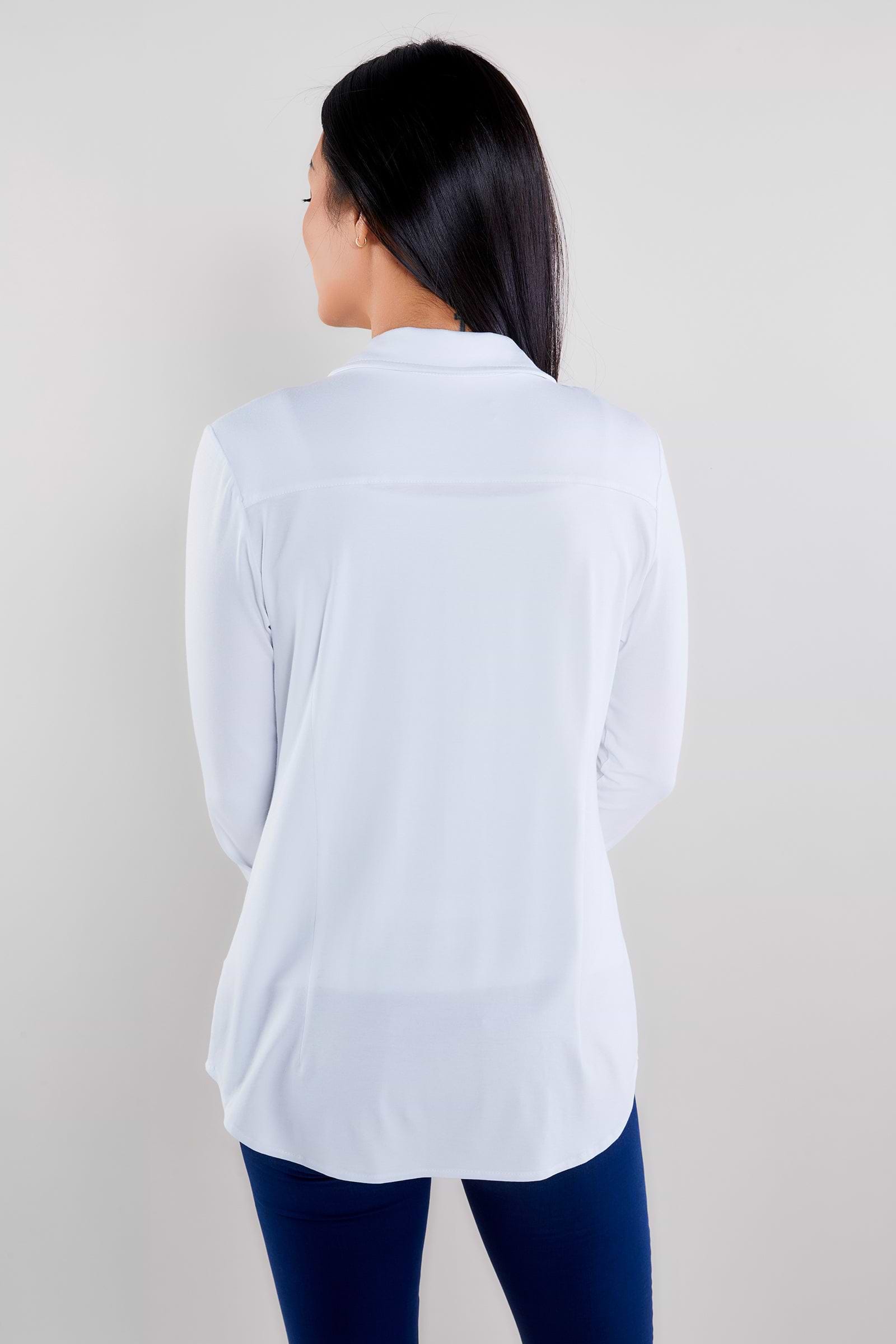 The Best Travel Shirt. Woman Showing the Back Profile of a Nikki Longsleeve Jersey Shirt in White