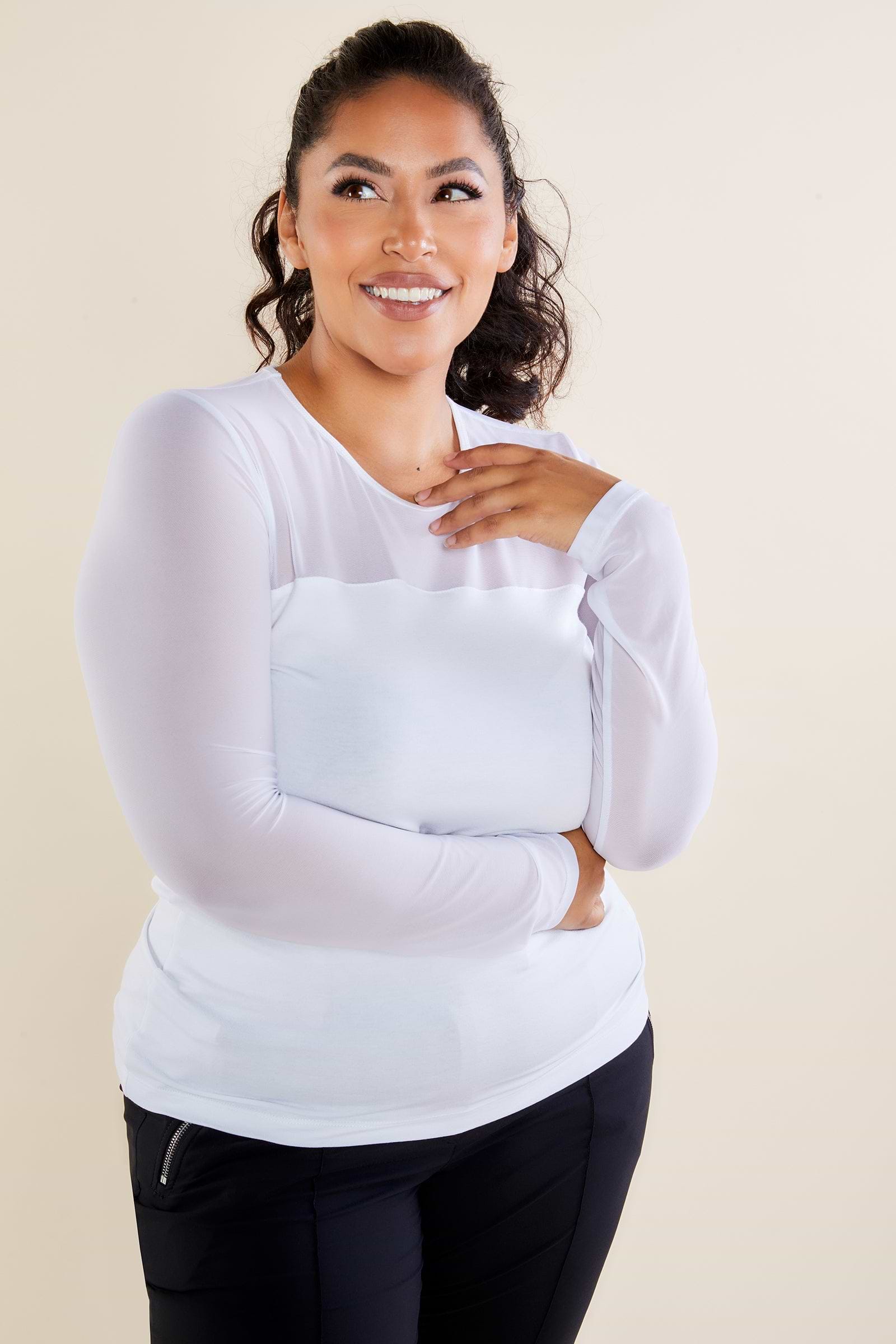 The Best Travel Shirt. Woman Showing the Front Profile of a Budah Mesh Pima Cotton Shirt in White