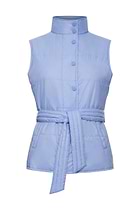 The Best Travel Vest. Woman Showing the Side Profile of an Ainslee Quilted Vest in Periwinkle with the Collar Up