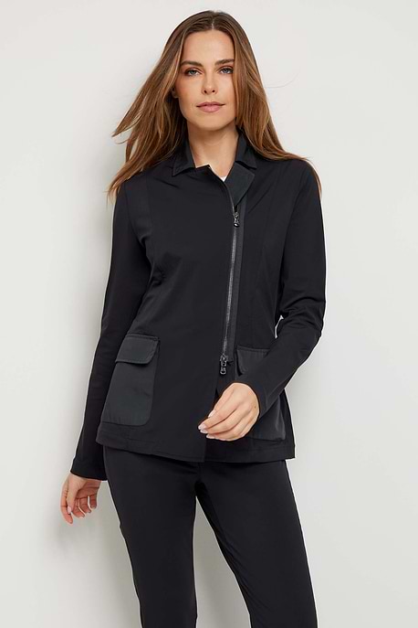 The Best Travel Jacket. Woman Showing the Front Profile of an Allegra Jacket in Black.