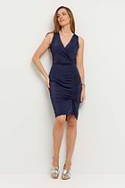 The Best Travel Dress. Woman Showing the Front Profile of an Avana Dress in Navy.