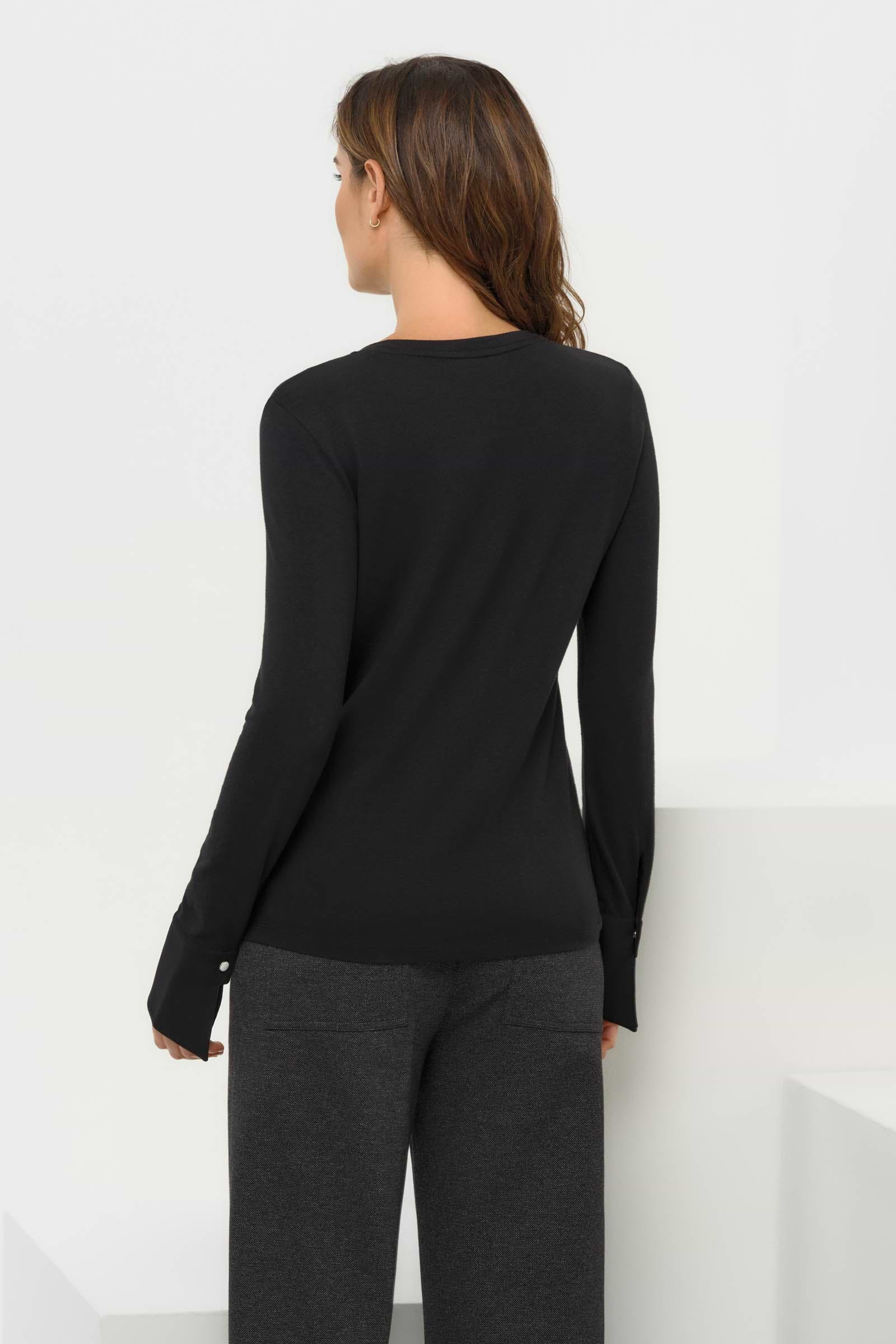 Back view of the Mayven Crewneck Top, revealing the clean, streamlined silhouette.