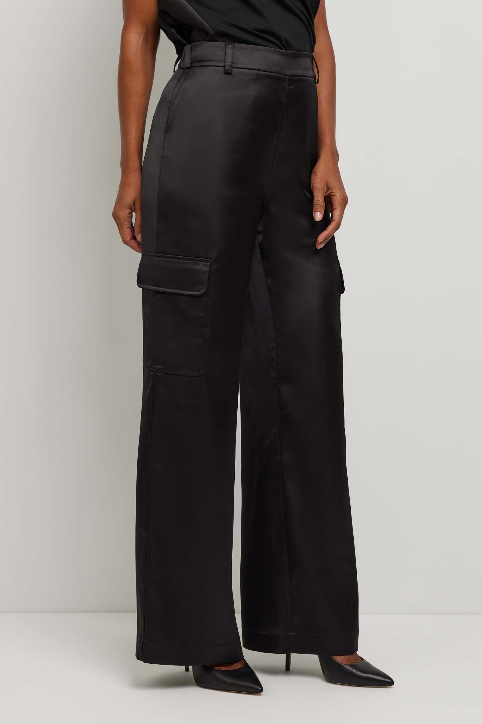 The Best Travel Pant. Side Profile of a Candela Satin Pant in Black.