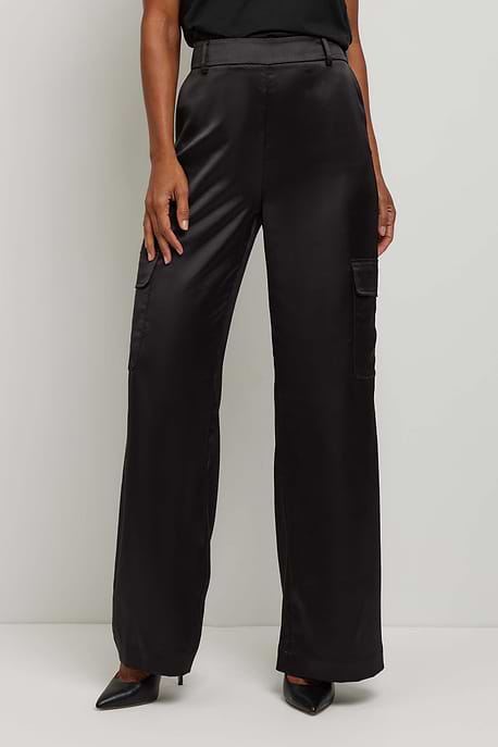 The Best Travel Pant. Front Profile of a Candela Satin Pant in Black.