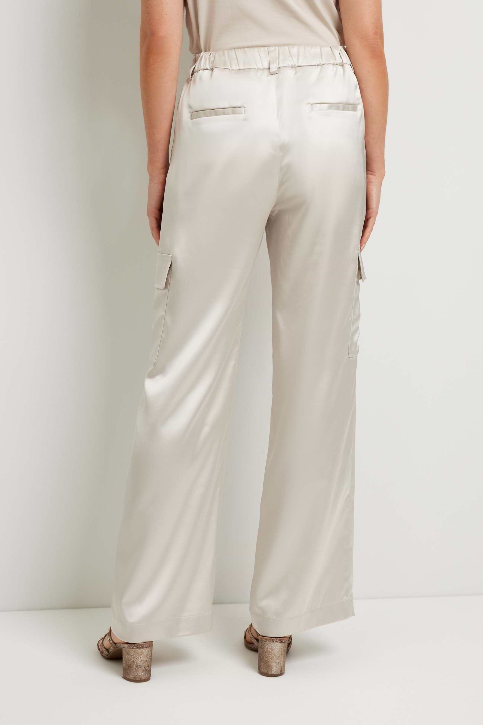 The Best Travel Pant. Back Profile of a Candela Satin Pant in Stone.