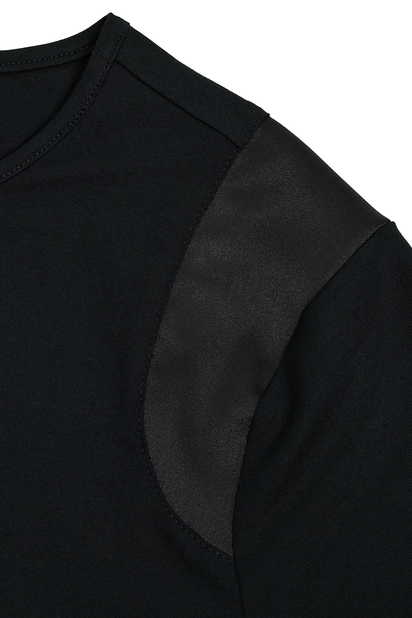The Best Travel Top. Shoulder Details of a Carmella Top in Black.