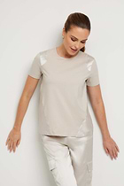 The Best Travel Top. Woman Showing the Front Profile of a Carmella Top in Stone.