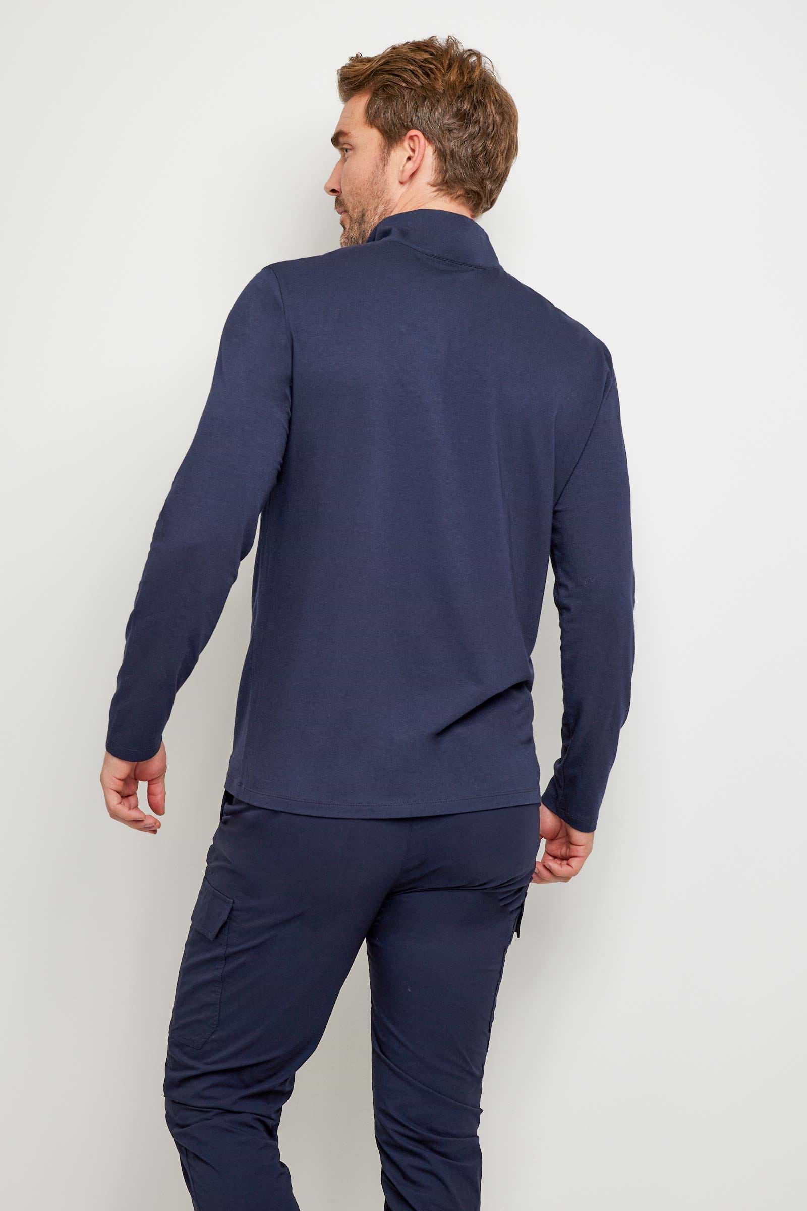 The Best Travel Top. Man Showing the Back Profile of a Men's Charlie Top in Navy.