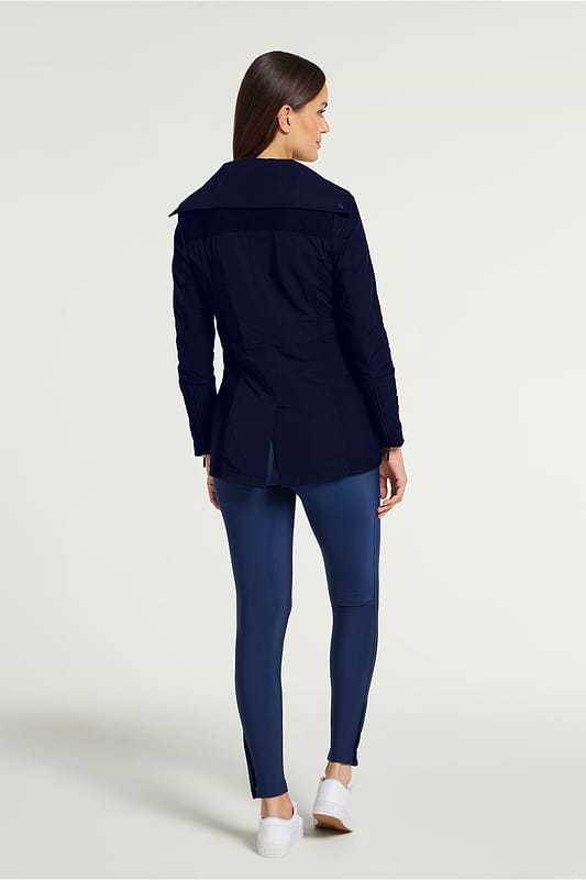 The Best Travel Jacket. Woman Showing the Back Profile of a Travel City Slick Jacket in Navy