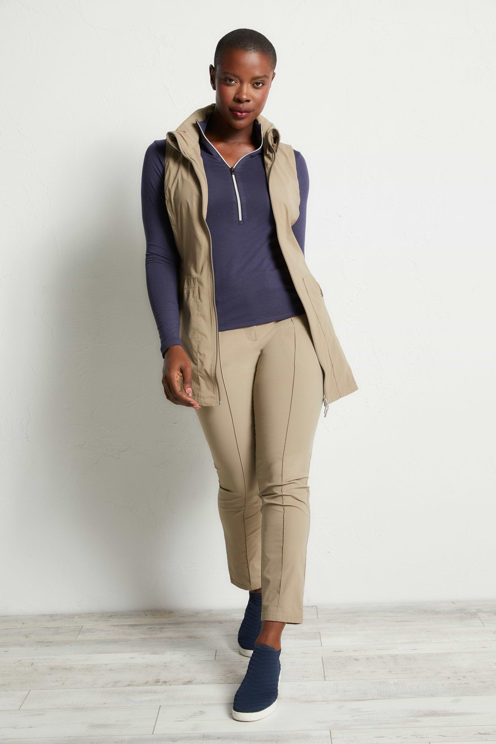 The Best Travel Vest. Woman Showing the Front Profile of a Delaney Travel Vest in Khaki