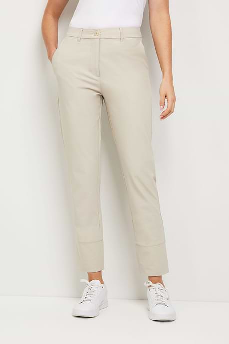 The Best Travel Pants. Woman Showing the Front Profile of a Gemma Pant in Champagne.