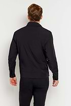 The Best Travel Jacket. Man Showing the Back Profile of a Men's Jack Zip Jacket in Black.