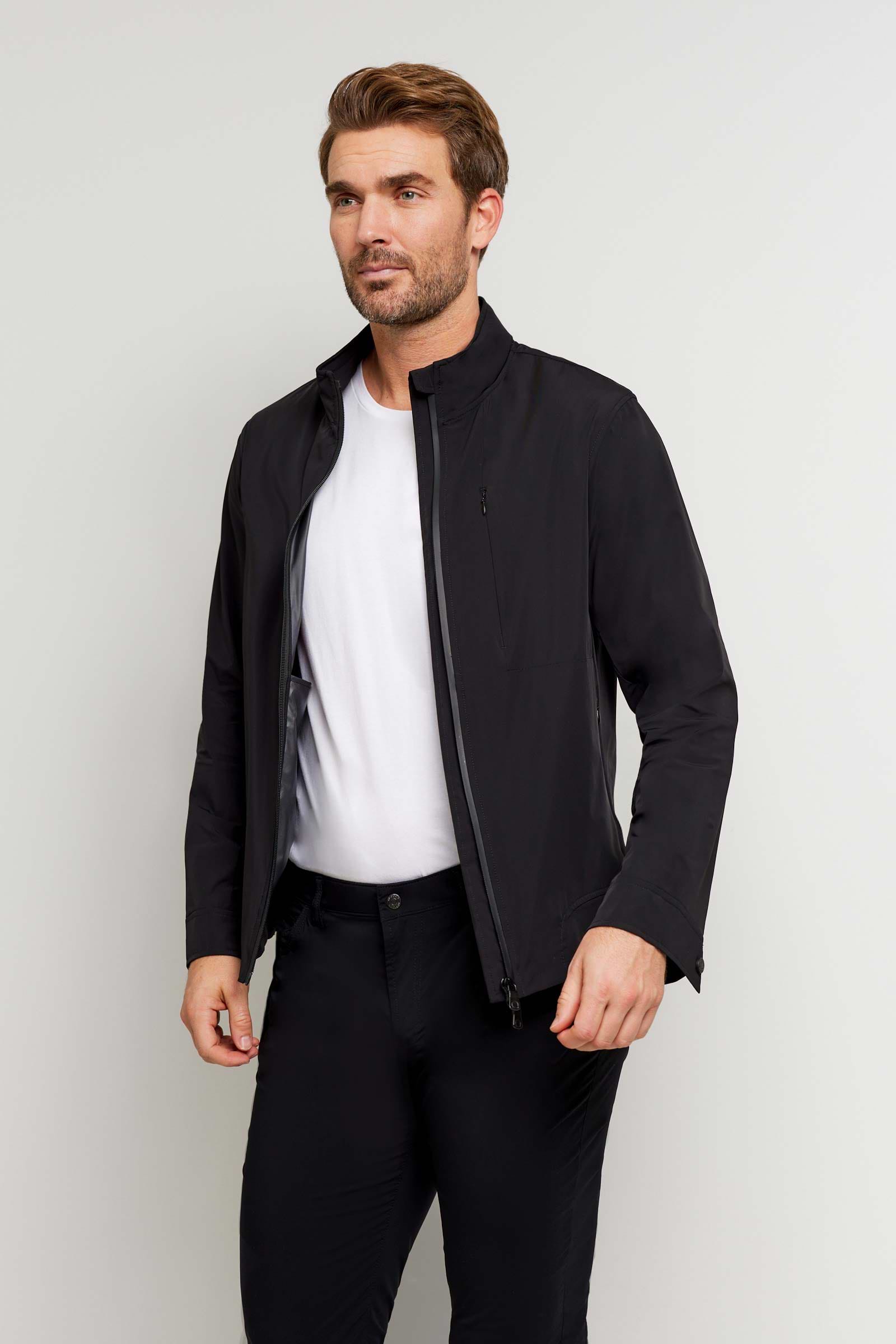 The Best Travel Jacket. Man Showing the Side Profile of a Men's Jack Zip Jacket in Black.