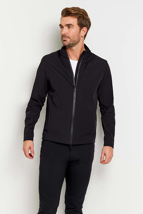 The Best Travel Jacket. Man Showing the Front Profile of a Men's Jack Zip Jacket in Black.