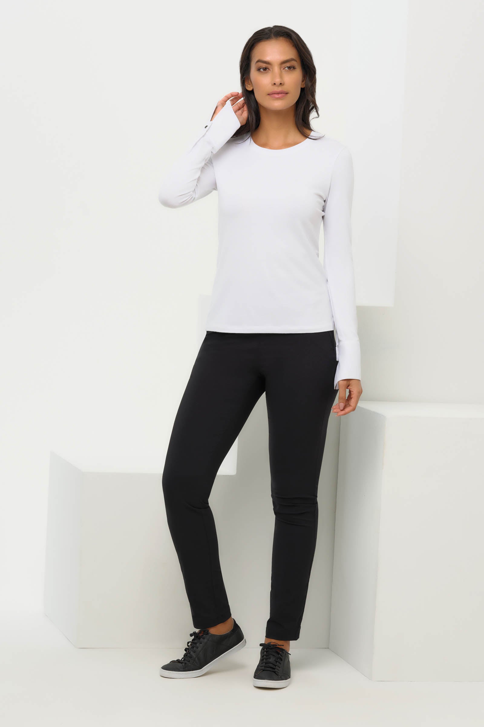 Last view of the Mayven Crewneck Top in White, showcasing the slim fit and tailored cuffs.