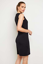The Best Travel Dress. Woman Showing the Side Profile of a Johanna Dress in Black.