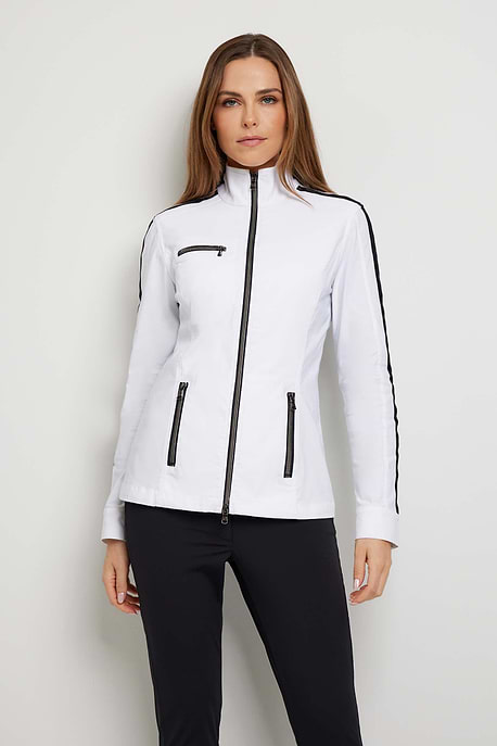 The Best Travel Jacket. Woman Showing the Front Profile of a Justine Jacket in White.