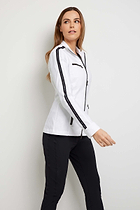 The Best Travel Jacket. Woman Showing the Side Profile of a Justine Jacket in White.