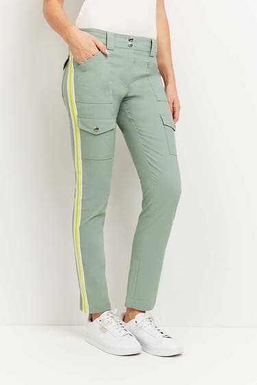 The Best Travel Pants. Woman Showing the Front Profile of a Kate Stripe Pants in Sage.