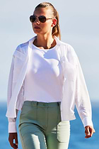 The Best Travel Pant. Lifestyle Image of a Darby Pant in Sage.
