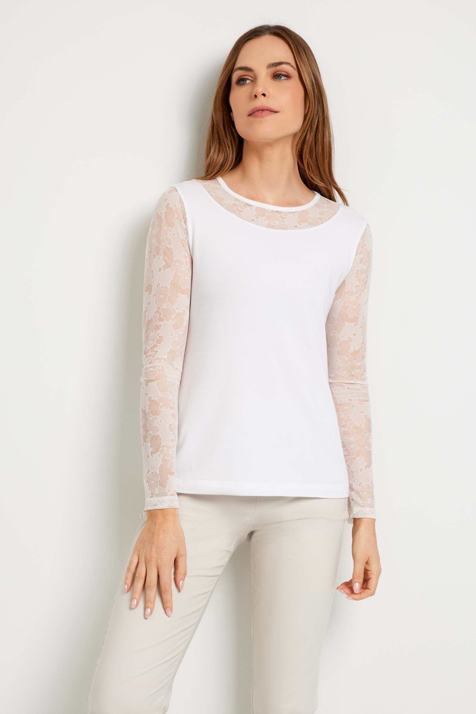 The Best Travel Top. Woman Showing the Front Profile of a Kim Camo Mesh Top in White.