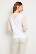 The Best Travel Top. Woman Showing the Back Profile of a Kim Camo Mesh Top in White.