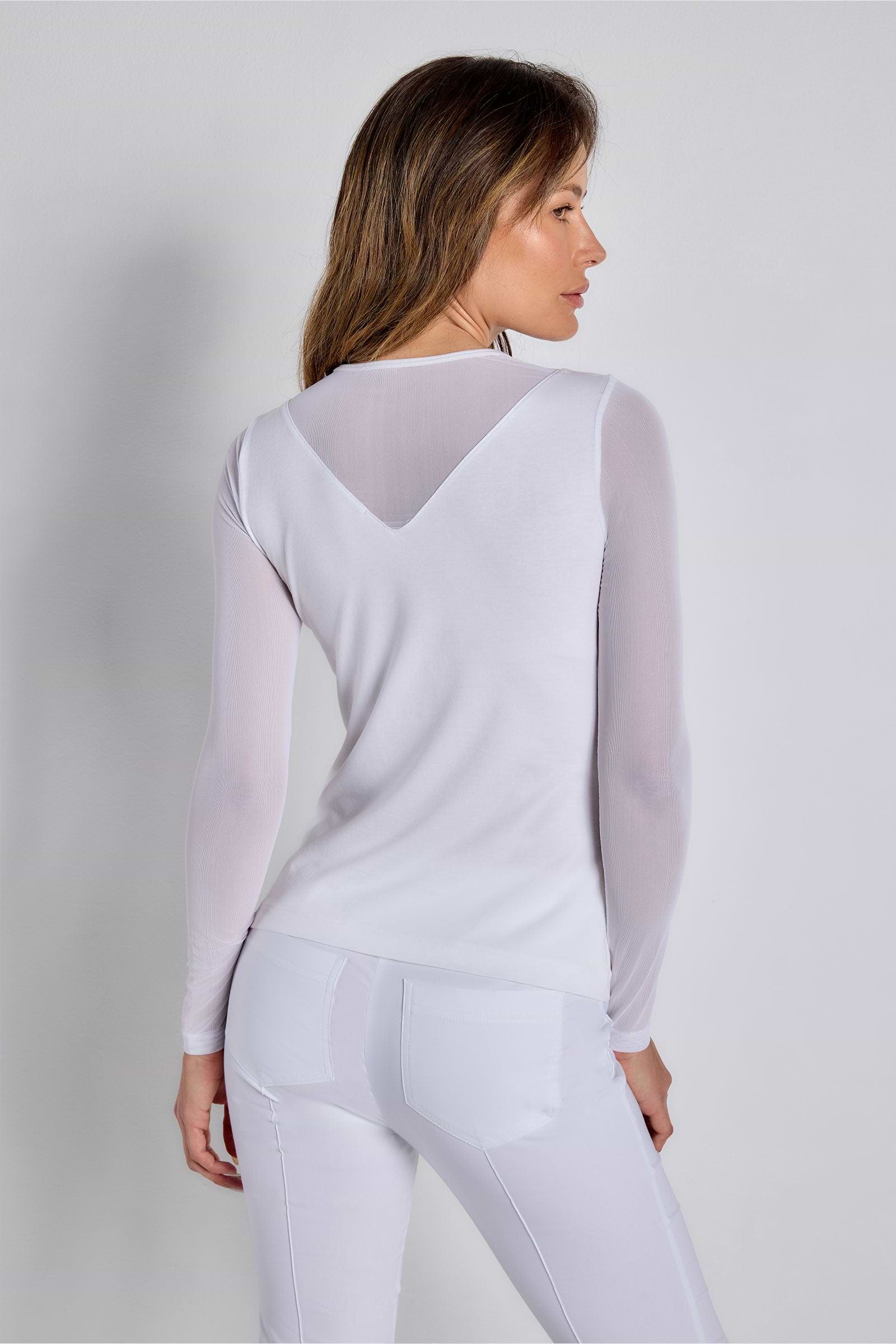 The Best Travel Top. Woman Showing the Back Profile of a Kim Mesh-Sleeve Top in Pima Modal in White.