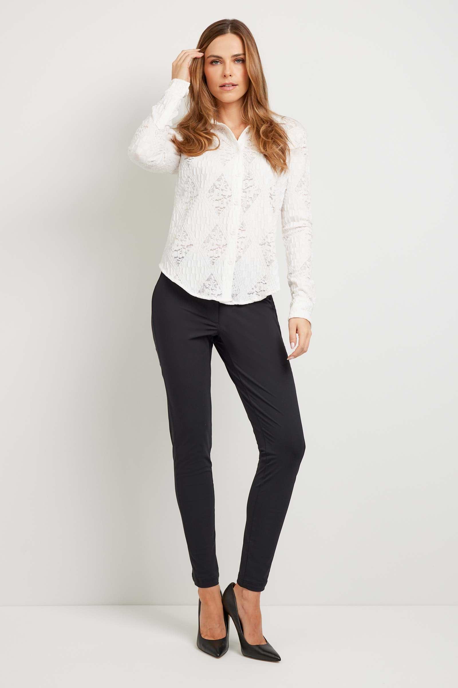The Best Travel Top. Woman Showing the Front Profile of a Lace Taylee Top in White.