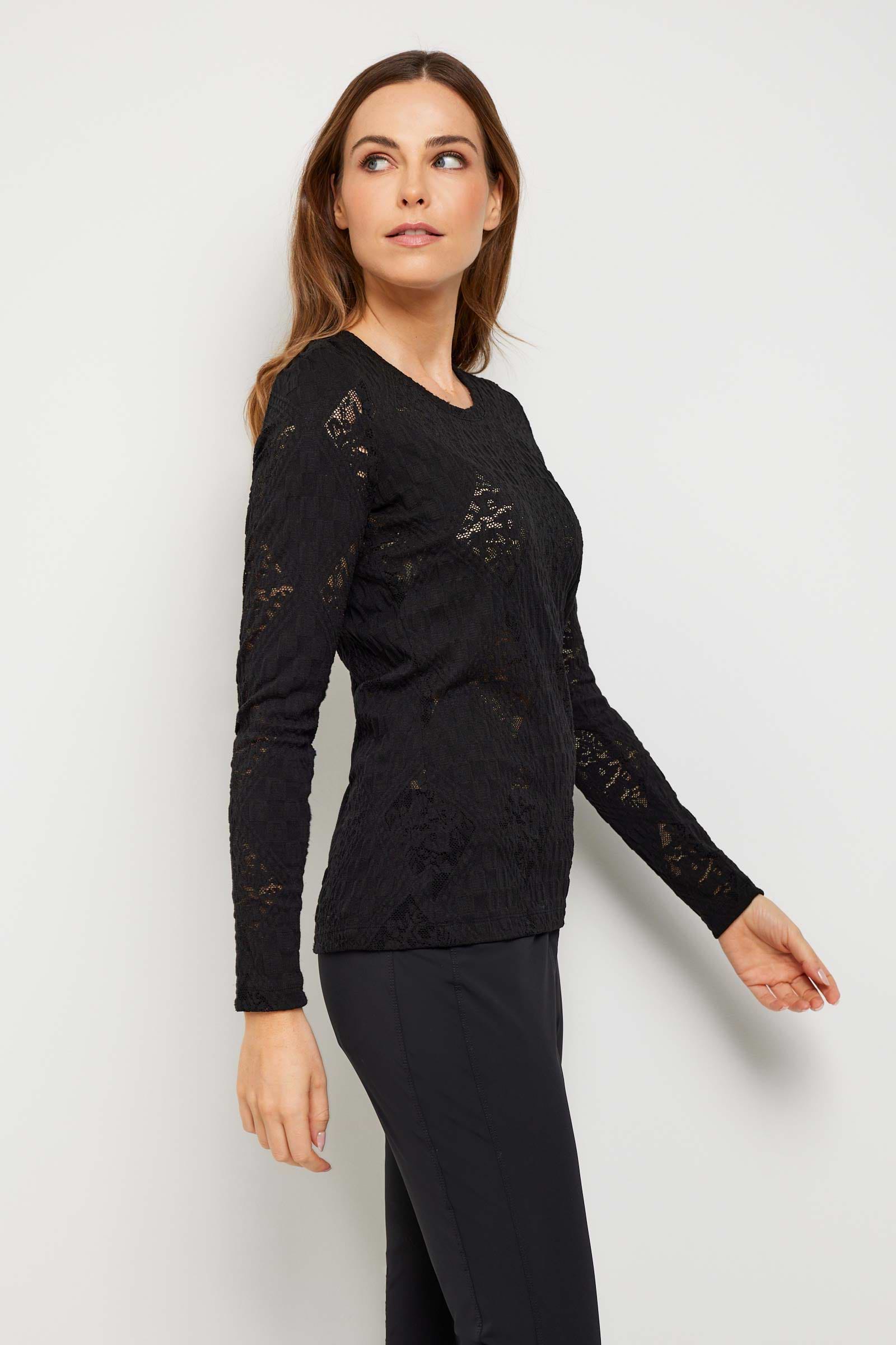 The Best Travel Top. Woman Showing the Side Profile of a Lace Juliana Top in Black.