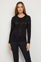 The Best Travel Top. Woman Showing the Front Profile of a Lace Juliana Top in Black.