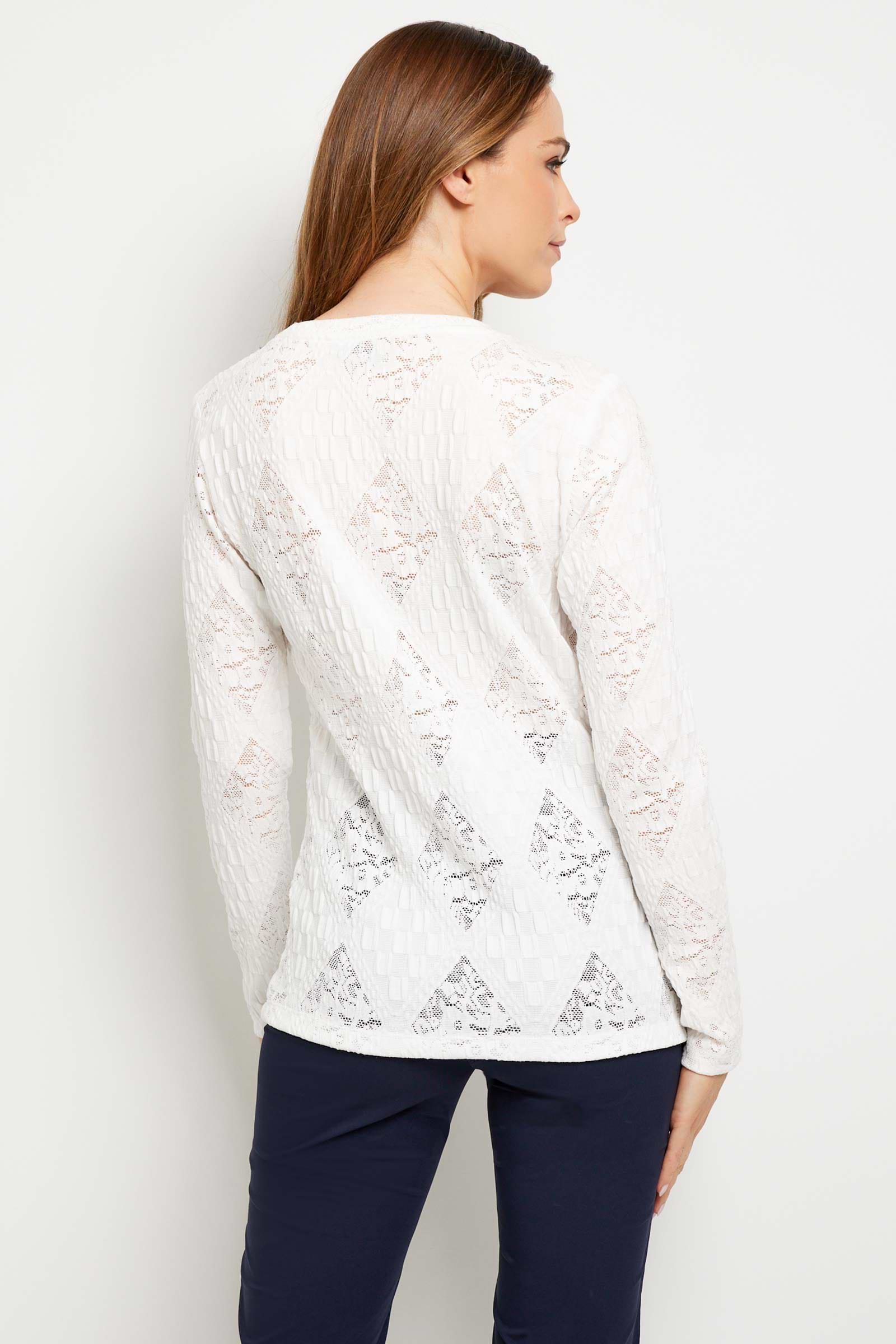 The Best Travel Top. Woman Showing the Back Profile of a Lace Juliana Top in White.