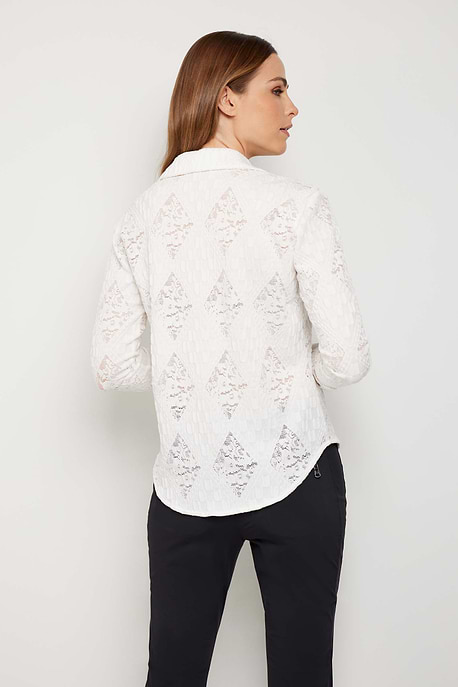 The Best Travel Top. Woman Showing the Back Profile of a Lace Taylee Top in White.
