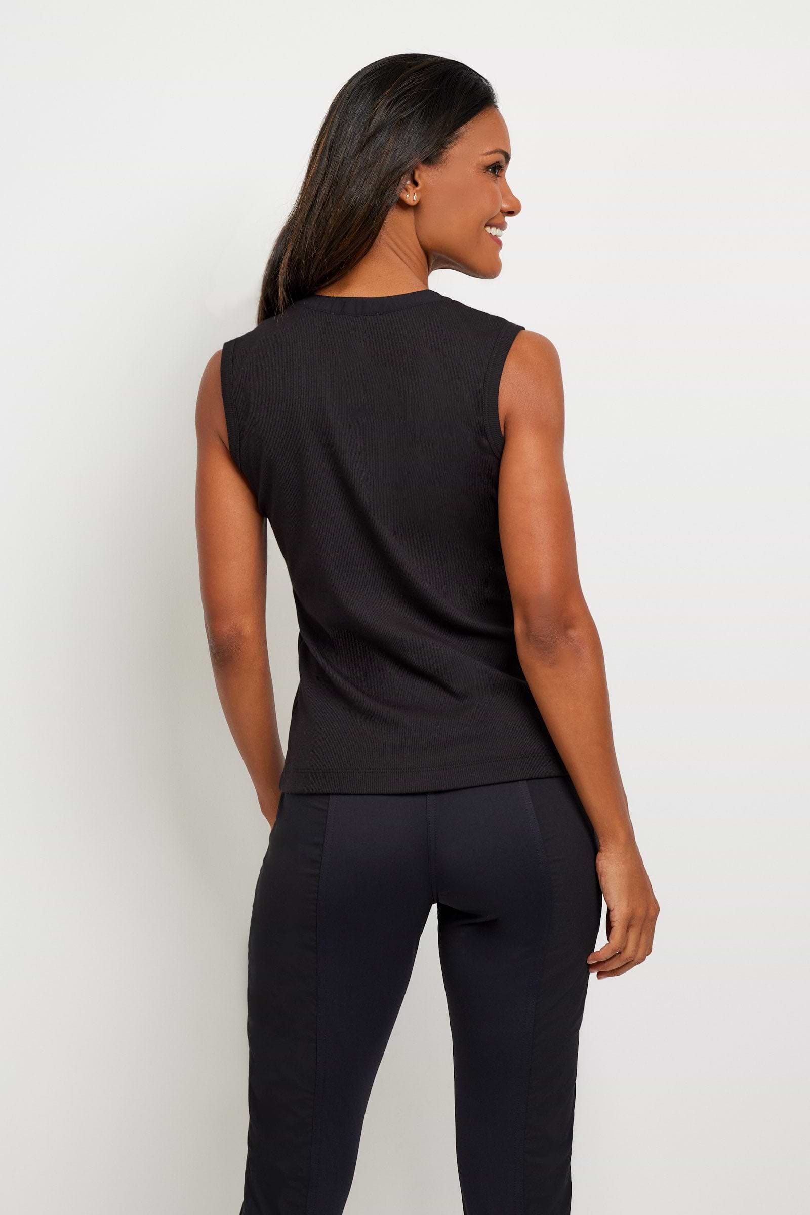 The Best Travel Top. Woman Showing the Back Profile of a Madelyn Top in Black.