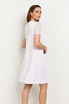 The Best Travel Dress. Woman Showing the Back Profile of a Melissa Dress in White.